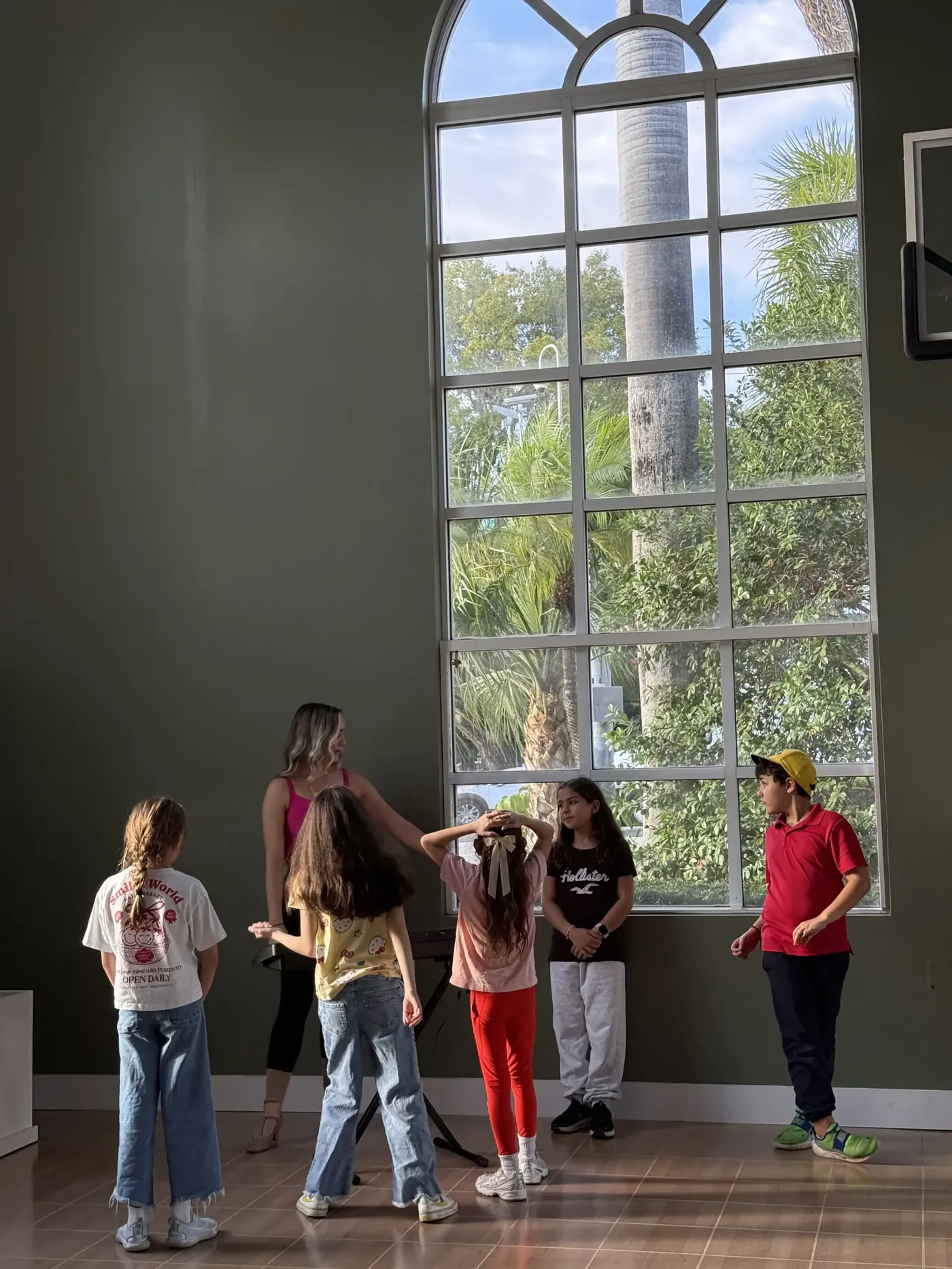Musical theater students rehearsing together in a bright studio