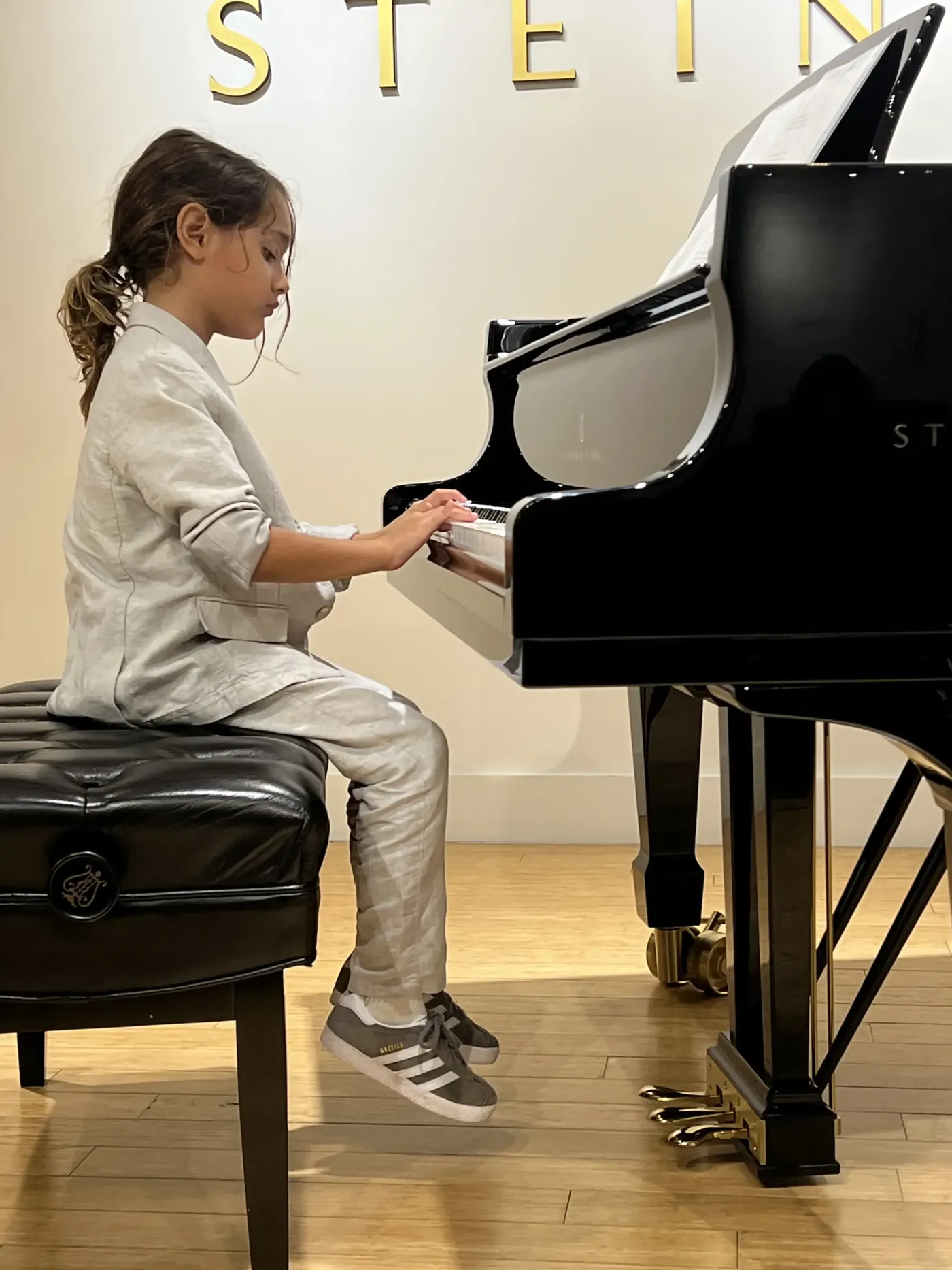 Young pianist at a Steinway grand piano during a recital